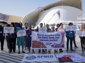 Activists demonstrate at the COP28 UN Climate Summit, Wednesday, Dec. 6, 2023, in Dubai, United Arab Emirates.