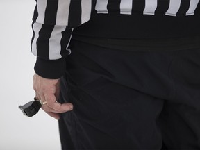 FILE PHOTO: A hockey official on the ice.