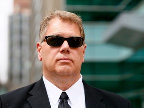 Philip Heerema leaves Calgary Courts after sentencing in Calgary on Tuesday May 1, 2018. A judge has approved a partial settlement in a class-action lawsuit against the Calgary Stampede that alleged the organization allowed Heerema, a performance school staffer, to sexually abuse young boys.