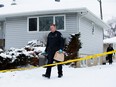Police work at the scene of a suspicious death at a home at 12314 127 St., in Edmonton on Monday, Jan. 22, 2024. On Sunday, Jan. 21, 2024, at approximately 12:15 p.m., police responded to the residence and discovered a deceased woman. Due to the suspicious nature of the death, the homicide unit is now leading the investigation.