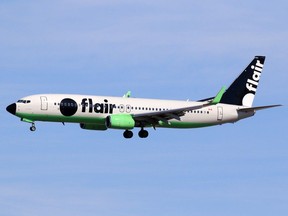 A Flair Airlines jet lands at the Calgary International Airport on Thursday, March 26, 2020.