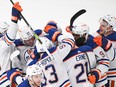 Edmonton Oilers players celebrate a goal