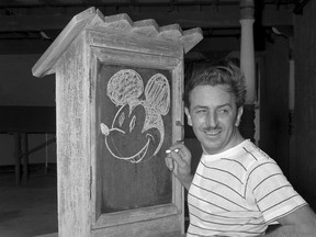 Walt Disney, creator of Mickey Mouse, poses for a photo at the Pancoast Hotel, Aug. 13, 1941, in Miami, Fla.