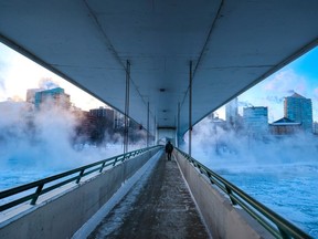 The current cold spell gripping Alberta has sent electricity consumption soaring to a new record, says the Alberta Electric System Operator. This image shows steam rising from the Bow River and downtown buildings in Calgary on Friday, January 12, 2024.