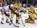 Zach Hyman #18 of the Edmonton Oilers and Alex Pietrangelo #7 of the Vegas Golden Knights vie for the puck as Adin Hill #33 of the Golden Knights defends the net in the first period of their game at T-Mobile Arena on February 06, 2024 in Las Vegas, Nevada. The Golden Knights defeated the Oilers 3-1.
