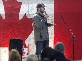 Marco Van Huigenbos speaks to convoy supporters in a trucking yard shop in Lethbridge, Alta. following an event on Saturday, January 27, 2024 for the second anniversary of the Coutts border blockade.