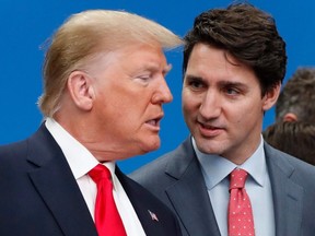 Former U.S. president Donald Trump, left, and Canadian Prime Minister Justin Trudeau talk prior to a NATO round able on Dec. 4, 2019.