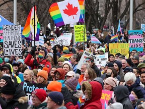 Protesters fill the plaza in front of Calgary City Hall to rally against the Alberta government’s proposed transgender policies, on Saturday, Feb. 3, 2024.