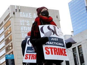 workers rally outside stanley miler library as csu 52 contract talks stall