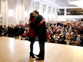 MLA Rakhi Pancholi embraces Alberta NDP leadership candidate Naheed Nenshi during a campaign rally in Edmonton on Tuesday, March 26, 2024. Pancholi dropped out of the leadership race to endorse Nenshi.