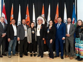 Chief Raymond Powder of the Fort McKay First Nations, centre, at a press conference in Edmonton for the signing of a memorandum of agreement with Suncor on March 7, 2024.