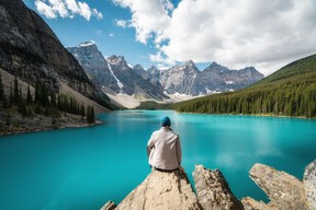 Hiker Looking at View at Moraine Lake, Banff National Park, Alberta, Canada