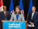 Premier Danielle Smith, Minister for Immigration and Multiculturalism Muhammad Yaseen and former Alberta Premier Ed Stelmach discuss Ukrainian evacuees and the federal government's immigration cap on temporary residents on March 27, 2024.