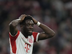 FILE -Bayern's Alphonso Davies reacts during the German Bundesliga soccer match between FC Bayern Munich and SC Freiburg at the Allianz Arena stadium in Munich, Germany, Oct. 8, 2023. Bayern Munich sports director Max Eberl says the club has made its final offer to Canada left back Alphonso Davies to extend his contract amid reported interest from Real Madrid. Eberl tells the Sport Bild magazine, "I can say we made Alphonso a very concrete, appreciative offer. At some point in life you have to say yes or no."