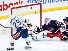 Oilers Leon Draisaitl scores against Jets goaltender Connor Hellebuyck