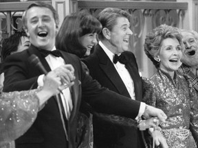 When Irish Eyes are Smiling: Then Prime Minister Brian Mulroney leads the chorus with wife Mila, U.S. President Ronald Reagan and First Lady Nancy Reagan at a Quebec City gala on March 17, 1985.