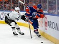 Warren Foegele battles for the puck along the wall against the LA Kings in Game 1 of the playoffs