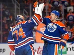 Goaltender Stuart Skinner #74 and Vincent Desharnais #73 of the Edmonton Oilers celebrate a 7-4 win against the Los Angeles Kings during the third period in Game 1 of the first round of the 2024 Stanley Cup playoffs at Rogers Place on Monday, April 22, 2024.