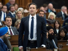 Leader of the Conservative Party Pierre Poilievre rises in response to the Speaker asking him to withdraw language during question period on April 30, 2024.