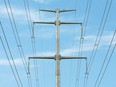 Power transmission lines are shown on the eastern edge of Calgary on Wednesday, July 18, 2018. Calgarians are using more AC power in the summer for items like air conditioning and fans. Jim Wells/Postmedia