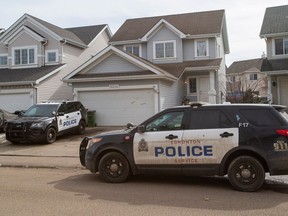 Edmonton police respond to a home where an 11-year-old boy was killed in an attack by two large dogs on April 1.