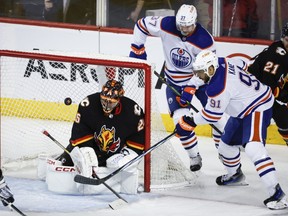 The NHL has assessed Edmonton Oilers forward Evander Kane a maximum fine of US$5,000 for slashing Calgary forward Dryden Hunt in a game Saturday night. Kane (91) tries to score on Calgary Flames goalie Jacob Markstrom (25) as forward Warren Foegele (37) looks on during third period NHL hockey action in Calgary, Alta., Saturday, April 6, 2024.