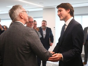 Prime Minister Justin Trudeau meets with Rich Kruger, CEO of Suncor Energy, during a fireside chat at Calgary Economic Development on April 5, 2024.