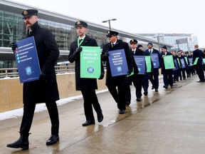 WestJet Encore pilots picketed at the Calgary International Airport on Friday, March 22, 2024.