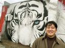 Busyrawk with The White Tiger of the West mural behind the China Marble Restaurant, 10566 97 St. The artist is working to paint three more in The Four Guardians of Chinatown series. Fish Griwkowsky, Postmedia