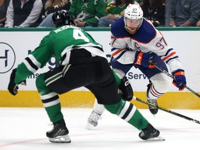 Connor McDavid #97 of the Edmonton Oilers skates with the puck against Miro Heiskanen #4 of the Dallas Stars during the second period in Game 2 of the Western Conference Final of the 2024 Stanley Cup Playoffs at American Airlines Center on May 25, 2024, in Dallas, Texas.