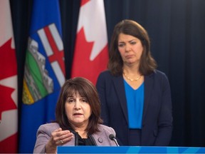 Health Minister Adriana LaGrange with Premier Danielle Smith at a news conference on Nov. 22, 2023.