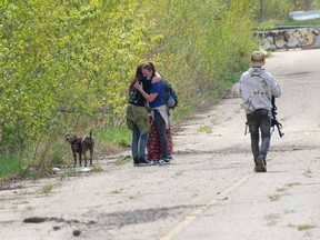 The mother of a 15 year-old St. Albert teenager on Wednesday, May 22, 2024, visits the spot where her son was fatally assaulted on Tuesday, May 22, 2024. The area near 184 Street and 137 Ave. Is popular with dog walkers.
