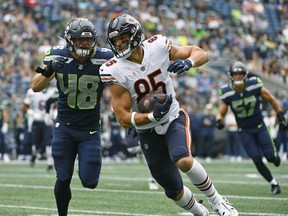 Chicago Bears tight end Cole Kmet (85) tries to avoid a tackle by Seattle Seahawks linebacker Joel Dublanko (48) during the first half of a preseason NFL football game, Thursday, Aug. 18, 2022, in Seattle.