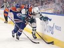 San Jose Sharks' Mario Ferraro (38) and Edmonton Oilers' defenceman Philip Broberg (86) battle for the puck during NHL action in Edmonton on Monday March 20, 2023. It appears Broberg will see his first action of the playoffs against the Dallas Stars on Wednesday.