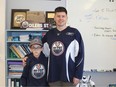 Principal and student who are big Oilers fans