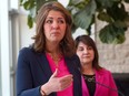 Premier Danielle Smith and Minister of Health Adriana LaGrange speak at a news conference at the Foothills Medical Centre in Calgary on Friday, May 3, 2024.