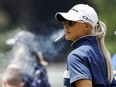 Charley Hull smokes a cigarette on the 9th tee during the first round of the U.S. Women's Open.