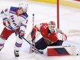 Sergei Bobrovsky of the Florida Panthers makes a save against Chris Kreider of the New York Rangers.