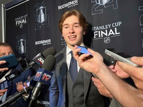 Macklin Celebrini, the expected No. 1 pick in the NHL draft to the San Jose Sharks, speaks with reporters prior to Game 2 of the Stanley Cup final.