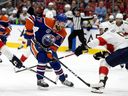 The Edmonton Oilers' Connor McDavid (97) battles the Florida Panthers' Gustav Forsling (42) and Aaron Ekblad (5)during the first period of Game 4 of the Stanley Cup Finals at Rogers Place, in Edmonton Saturday June 15, 2024. Photo by David Bloom