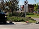 A memorial has been set up in a crosswalk at Allard Road and Allard Boulevard SW in Edmonton on Friday, June 28, 2024. A three-year-old boy was killed in the marked crosswalk on Thursday after being hit by a truck at a three-way stop.