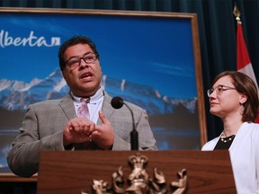 Then-Calgary mayor Naheed Nenshi speaks alongside then-Alberta environment and parks minister Shannon Phillips in this file photo from 2015.