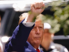 Donald Trump gestures to supporters outside Trump Tower in New York City on May 31, 2024. If Trump is elected for a second term in the Oval Office, Canada could face a massive influx of illegal migrants, warns Tasha Kheiriddin.