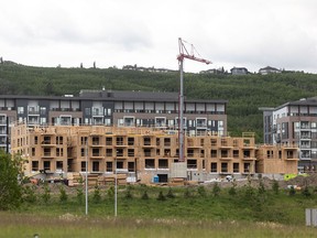 Condos are seen under construction in northwest Calgary on Wednesday, June 19, 2024.