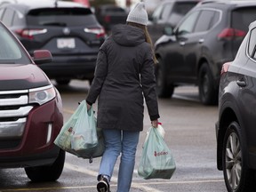 a consumer lugging plastic bags