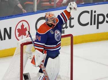 Edmonton Oilers goalie Stuart Skinner (74) celebrates his assist on Darnell Nurse (25) empty net goal against the  Florida Panthers during third period game 6 action of the NHL Stanley Cup final on Friday, June 21, 2024 in Edmonton.   Greg Southam-Postmedia