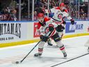 Moose Jaw Warriors forward Matt Savoie carried the hockey in the game against Saginaw Spirit in the opening game of the 2024 Memorial Cup in Saginaw, Michigan.