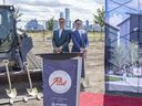 Kris Beyer, president of Launch Homes, left, and Aaron Guo of Stratosphere Properties broke ground Thursday, Aug. 1,  for their latest development in Blatchford called Pilot. Phase 1 is set to begin next week on the 90 units. Pilot will be built so that every home will be carbon-neutral ready.