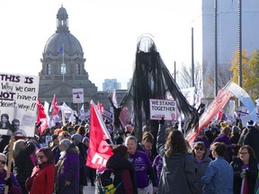 A collection of Alberta union members protest outside the Alberta legislature building in Downtown Edmonton on Thursday, Oct. 24, 2024.