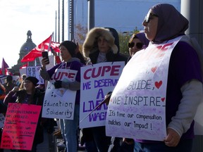 A collection of Alberta union members protest outside the Alberta legislature building in Downtown Edmonton on Thursday, Oct. 24, 2024.